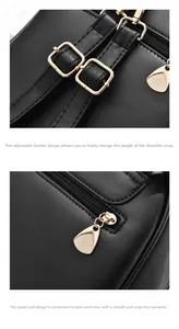 Détail de la bandoulière réglable en cuir noir avec boucle dorée et fermeture éclair
