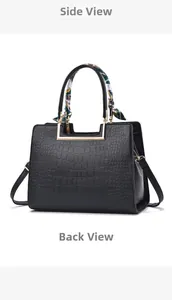 Detail view of black crocodile pattern leather bag with golden U-shaped metal buckle and scarf