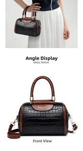 Detailed front view of a two-tone stone pattern Boston bag with gold hardware and strap