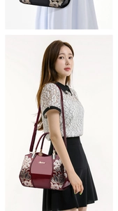 Detail showing red patent leather handbag with floral sequin embroidery and Pianee logo