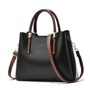 Classic black and brown women's top handle bag with adjustable strap and gold hardware