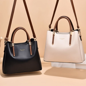 Fashionable PU leather tote bag in black and cream white with elegant gold hardware