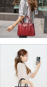 Close-up of red and black retro handbags with textured leather and gold hardware