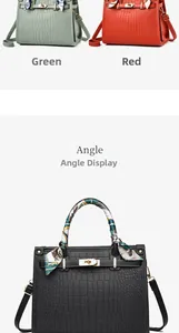 Detail of elegant crocodile embossed handbag with silk scarf handle and metal lock
