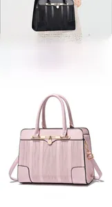 Detail of elegant pink tote bag featuring a 3D wave texture and gold twist-lock closure