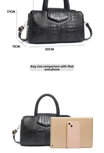 Size comparison of black crocodile pattern handbag with dimensions 30x11x17cm and iPad