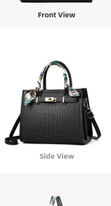 Macro detail of black crocodile pattern PU leather bag with gold buckle and silk scarf