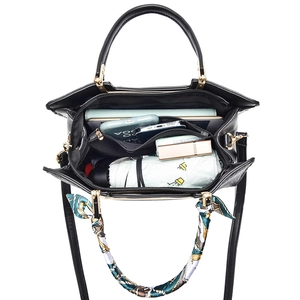 Black large capacity tote bag with crossbody strap and silk scarf showing spacious interior
