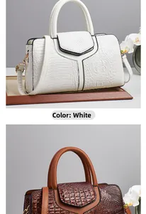 Detail view of crocodile pattern leather handbags in white and dark brown colors