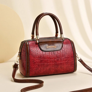 Retro red crocodile pattern Boston bag with dark brown handles and golden hardware