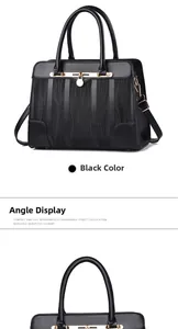 Close-up of black leather handbag featuring wave texture fabric and golden buckle details