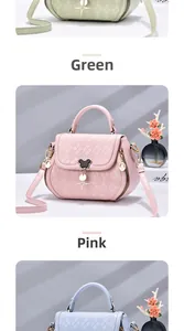 Detail of embossed PU leather bag with cartoon character metal clasp and star pendant