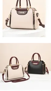Detail of color-block leather handbags with golden hardware and brand logo plate