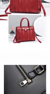 Detail view of red textured synthetic leather handbag with wavy pattern and golden metal hardware