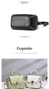 Detail view of the embossed leather texture and bottom metal studs on the crossbody bag