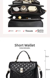 Detail view of the quilted black leather handbag interior compartments and golden lock