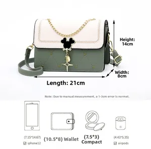 Detail of crossbody bag size 21x8x14cm showing capacity for phone, wallet and cosmetics