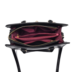 Large capacity black leather handbag for women featuring organized red interior compartments
