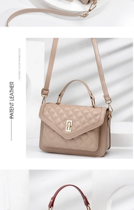 Close-up of quilted fashion handbag with contrast edging and elegant metal turn lock