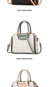 Detail of metal twist lock and logo plate on patterned crossbody handbag with letter prints
