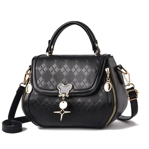 Fashionable black quilted crossbody bag with golden Mickey-shaped hardware and handle