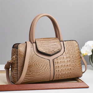 Elegant beige crocodile pattern handbag with Y-shaped stitching and gold metal hardware