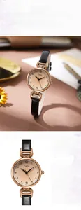 Dettaglio dell'orologio vintage da donna con cassa in oro rosa e cinturino nero