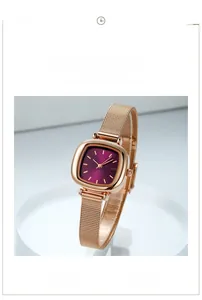 Detail of rose gold mesh strap and purple square dial watch on white pedestal