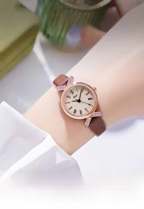 Detail of rose gold watch case with diamond-encrusted lugs and white Roman numeral dial