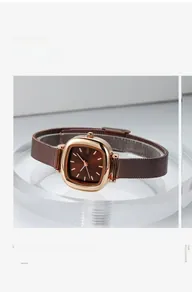 Detail of square rose gold watch with brown sunburst dial and Milanese mesh strap