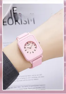 Close-up of a pink silicone GEDI watch featuring a round dial and rectangular case