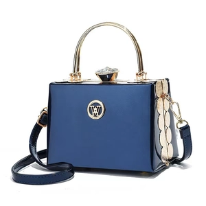 Glossy dark blue leather mini crossbody bag with gold W logo and gemstone clasp