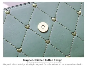 Detail of light green quilted leather bag with heart embroidery and magnetic snap closure