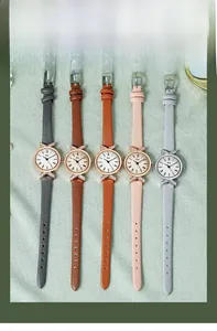 Flat lay of five quartz watches with leather straps and rhinestone bow details