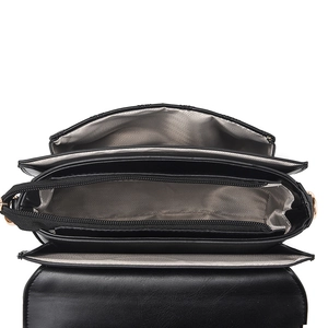 Black quilted crossbody bag with three interior compartments and herringbone lining