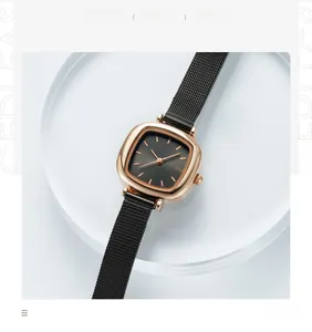 Detail of rose gold rectangular watch with black dial and Milanese mesh steel strap