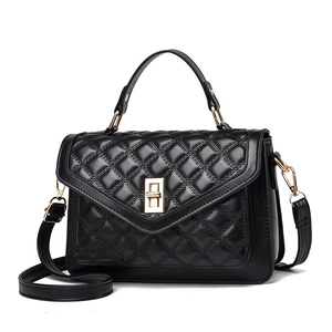 Classic black quilted crossbody bag with gold-tone hardware and elegant top handle