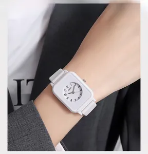 Fashionable white square quartz watch with silicone strap shown on a model's wrist