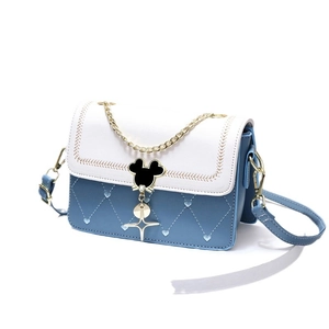 Quilted blue and white crossbody bag with heart patterns and metallic mouse-shaped buckle