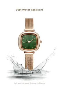 Detail of rose gold square watch with green dial and splash effect for 3ATM waterproof