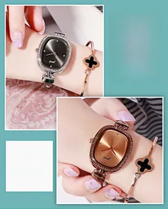 Detail view of oval rhinestone-encrusted quartz watches with luxury clover bracelet