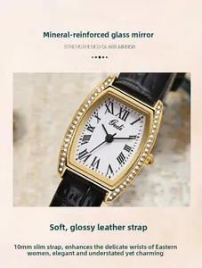Macro detail of tonneau watch face with Roman numerals and diamond-set gold case