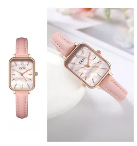 Macro shot of GEDI square mother of pearl dial and rose gold case on pink leather watch