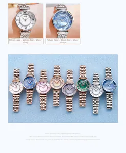 Detail of steel strap women watches with rhinestone bezel and eagle logo dial display