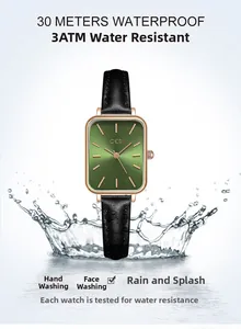 Detailed view of square rose gold watch with green dial and water splash effect