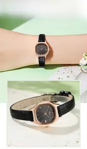 Detail of Gedi rose gold watch with black leather strap and date window displayed