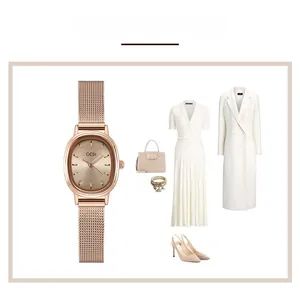 Close-up of rose gold oval watch with woven mesh strap and stylish OOTD outfit