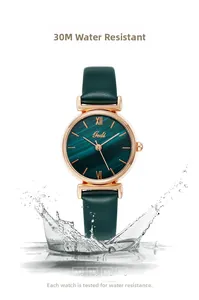 Detail showing 3ATM water resistance of green quartz watch with splashing water effect