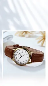 Detail of vintage GEDI quartz watch with brown leather strap and gold-tone round dial
