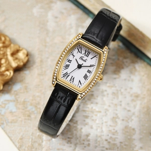 Macro detail of tonneau watch with crystal-encrusted bezel and Roman numerals